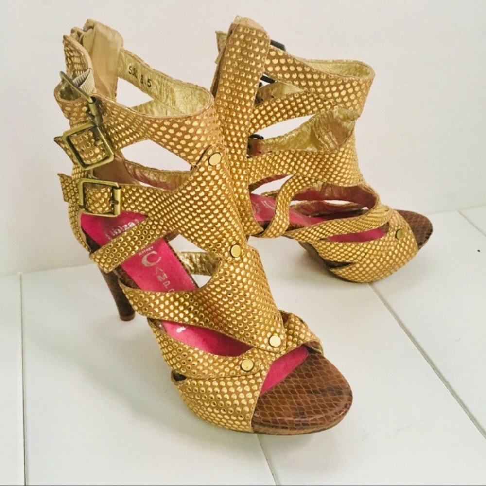 Gold Jeffrey Campbell snakeskin gladiator sandal.